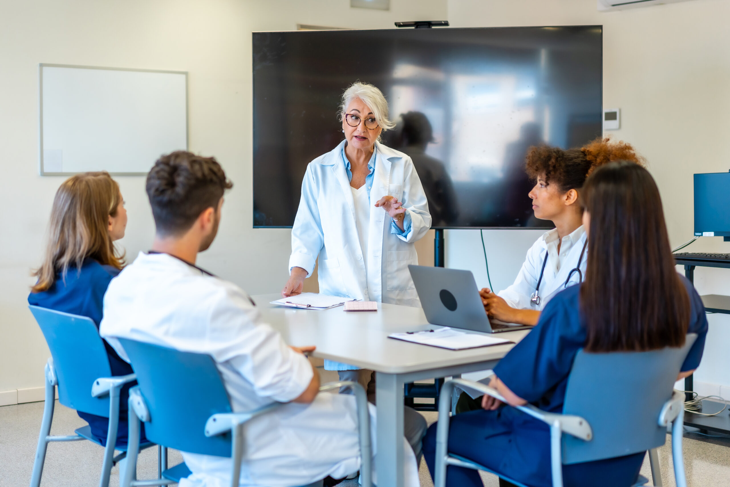 Senior doctor leading medical training for healthcare professionals